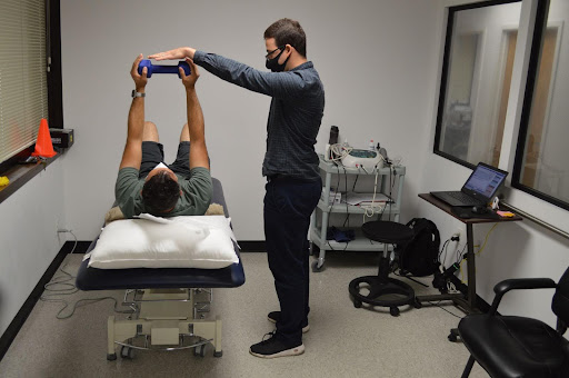 Physical therapist Dr. Perez teaches a Body Wellness patient key recovery techniques to help him become more resilient and stronger.