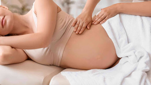 A woman undergoes prenatal chiropractic care as a proactive measure for her and her baby’s health and well-being.